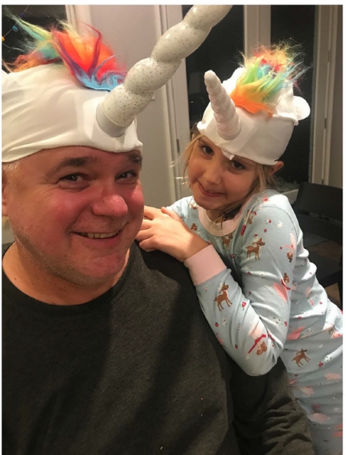 Katie and Tom having fun with unicorn hats. These two love being goofy together.