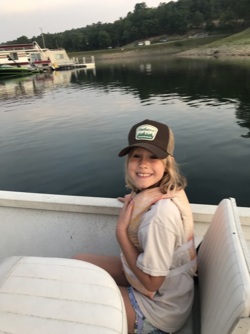 Fishing at the lake makes Katie happy.