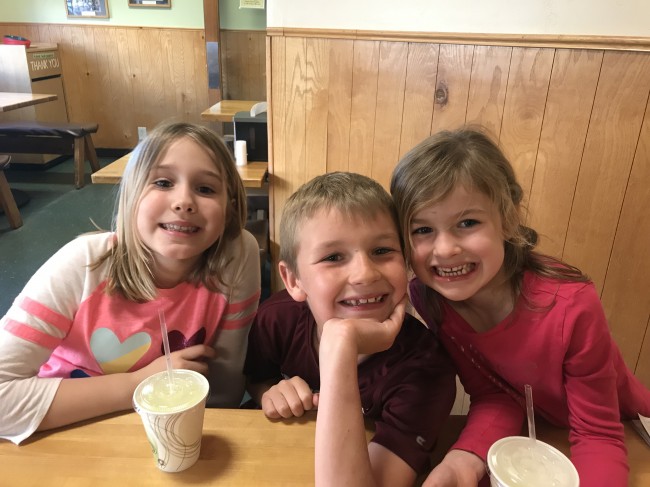Katie with two of her cousins, looking innocent and happy.