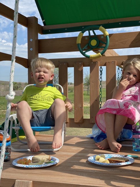 The kids have been having picnics for lunch on the playscape in our backyard on pretty days The kids have been having picnics for lunch on the playscape in our backyard on pretty days
