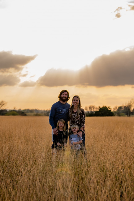While we were visiting family at their ranch, Aunt Vickie took us out to one of the pastures they own and asked to take some family photos of us. She got this amazing shot with the sun behind us and we loved it. While we were visiting family at their ranch, Aunt Vickie took us out to one of the pastures they own and asked to take some family photos of us. She got this amazing shot with the sun behind us and we loved it.