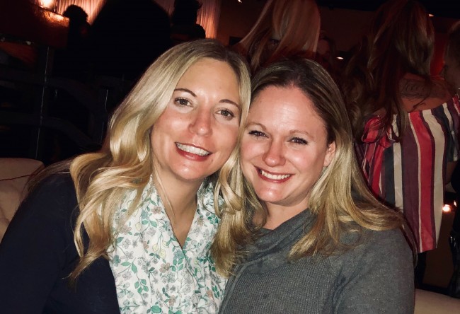 Amy and her bestie posing for a pic at dinner.