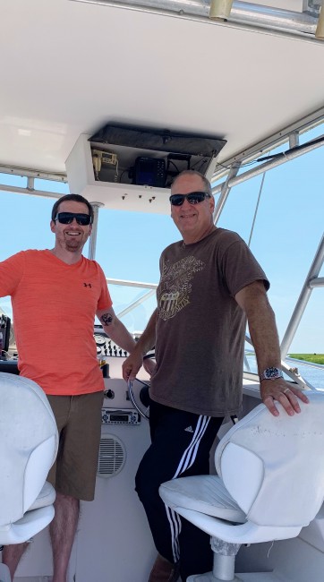 Matt and his Uncle posing on the boat.
