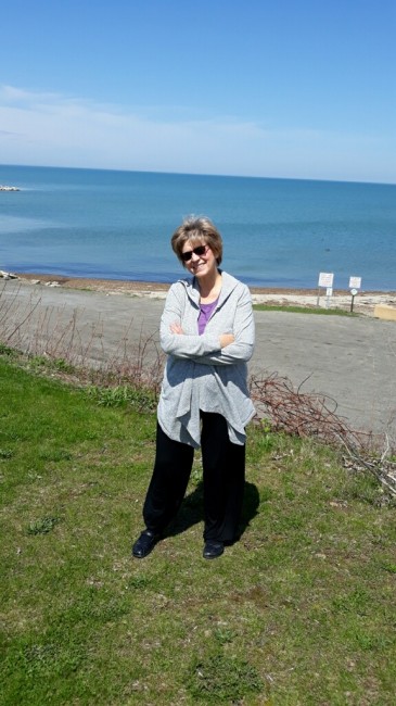 Amy's Mom, happy and smiling during a beach getaway.