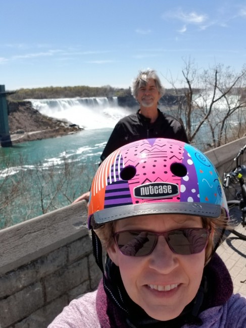 Amy's Mom and Dad posing for a pic during a bike ride.