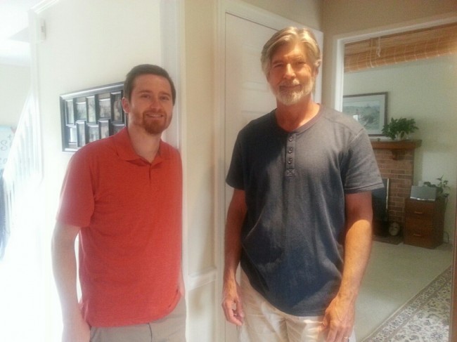 Matt and Amy's dad posing for a pic in the kitchen.