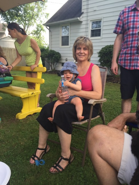Amy's Mom and Amy's god daughter at a backyard birthday celebration.