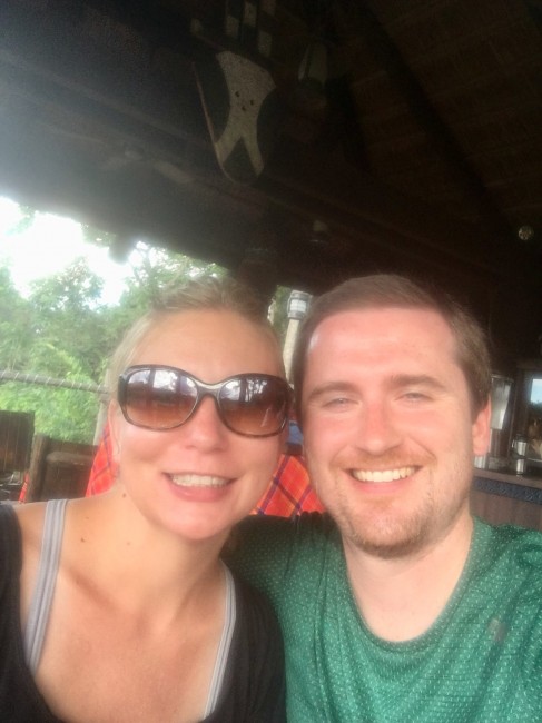 Posing for a pic while snacking on a terrace overlooking a safari.