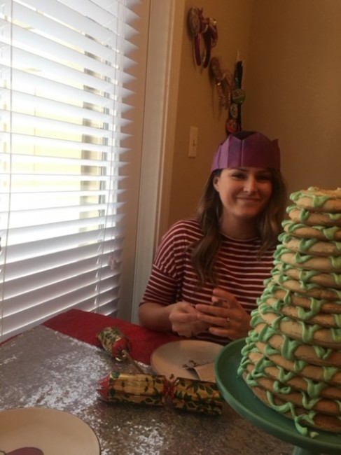 Meaghan's sister-in-law wearing her crown from the Christmas cracker while posing with the krunsekake.