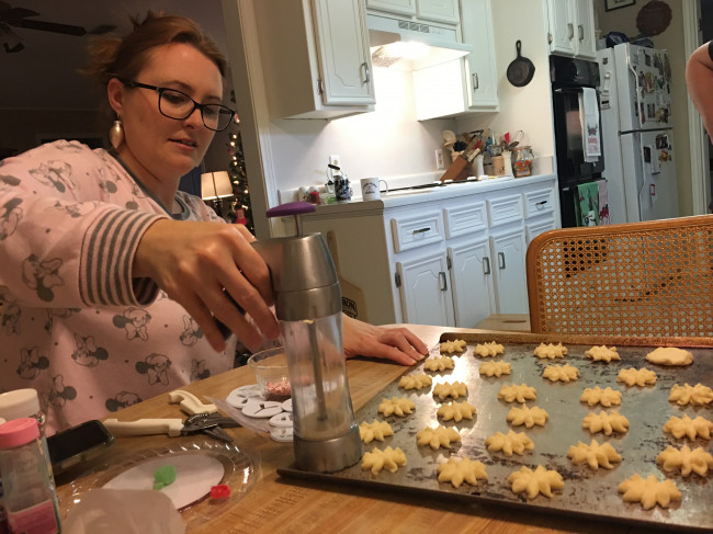 Meaghan learned how to work the dough gun for making Spritz cookies. These new dough guns are a lot easier than the old hand crank ones! Meaghan learned how to work the dough gun for making Spritz cookies. These new dough guns are a lot easier than the old hand crank ones!