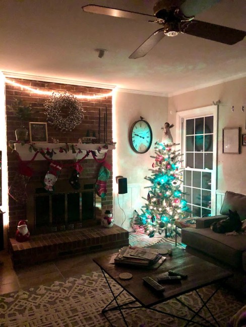 Each year, we put up two Christmas trees. This is in our back living room where we also hang our 4 stockings. We can't wait to add one more little stocking to the mantle :)