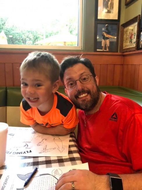 Coloring with our nephew while we waited for lunch to arrive.