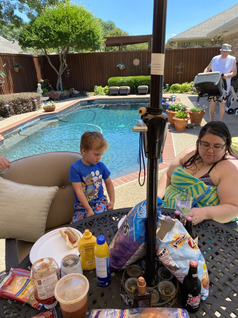 Family cookout after a summer swim. Our nephew and I were waiting for Uncle Wyatt to serve up the hot dogs and burgers.