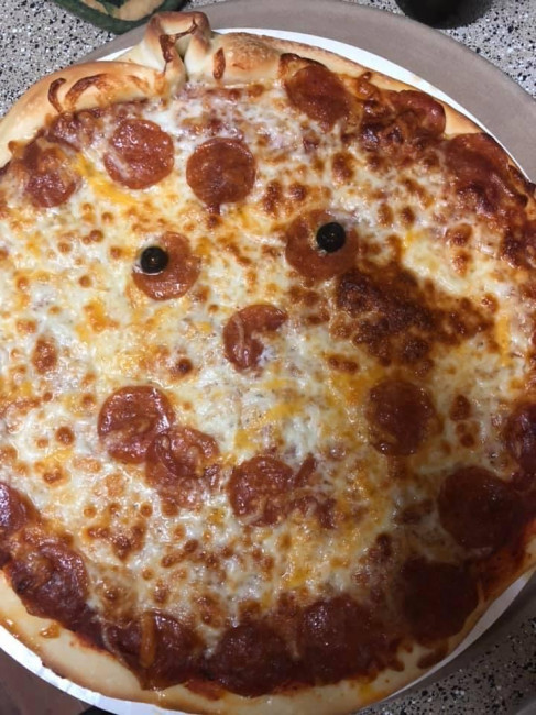 Halloween night means a pepperoni pumpkin pizza!
