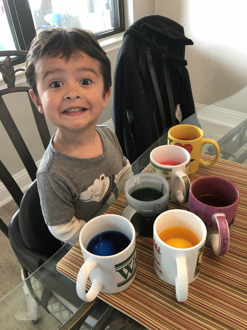 Conner's first time dying Easter eggs.