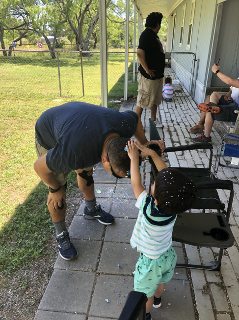 Easter wouldn't be complete without cascarones. Conner is getting his poor uncle.