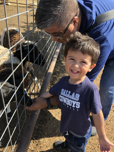 Jeff and Conner feeding the animals at the pumpkin patch. Conner loves goats now.