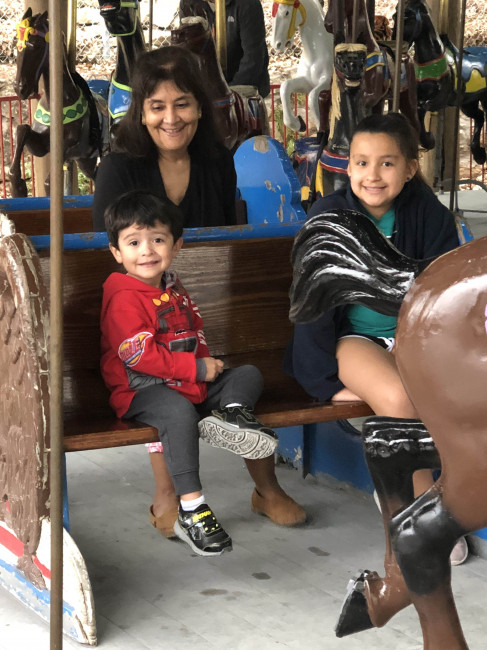 Conner convinced Grams to take a whirl on the carousel.