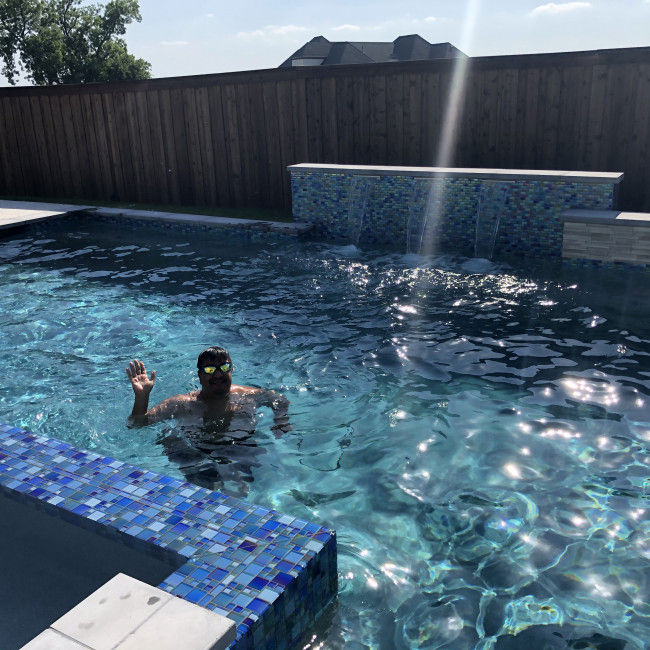 Jeff taking the first dip in the pool of the season...not quite warm enough for Tracie and Conner!