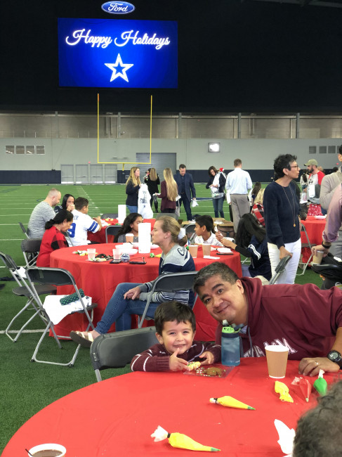 Conner & Jeff decorating cookies with the Cowboys.