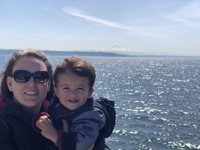 Tracie and Conner riding a ferry with Mt. Rainier in the background.