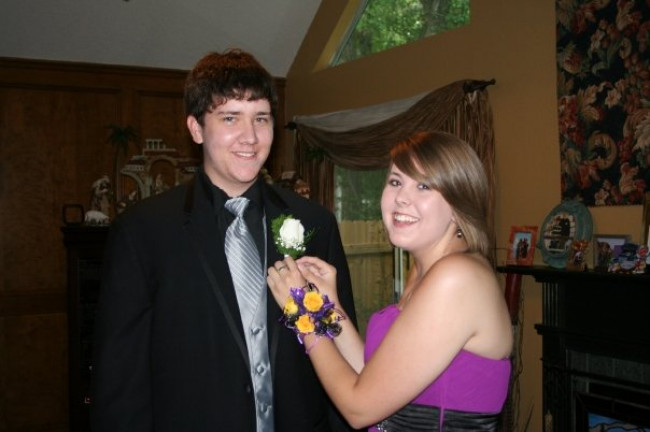 Laurice was afraid to hurt Jarrett when pinning the flower on his jacket, so this is just a pretend photo.