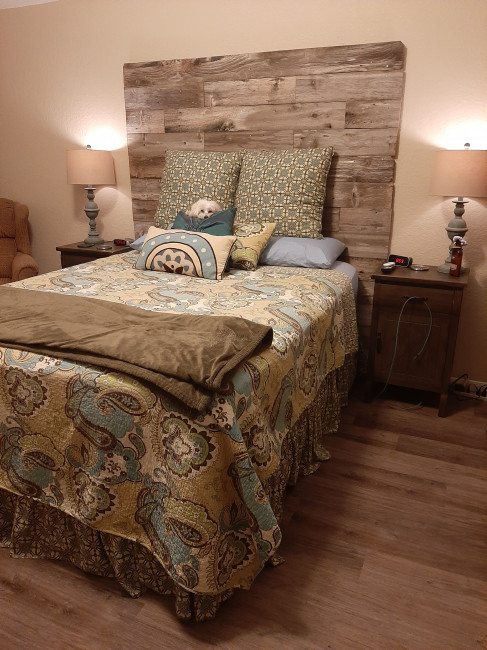 Our headboard, that we built for Valentines. Do you notice Cleo hiding in our pillows?