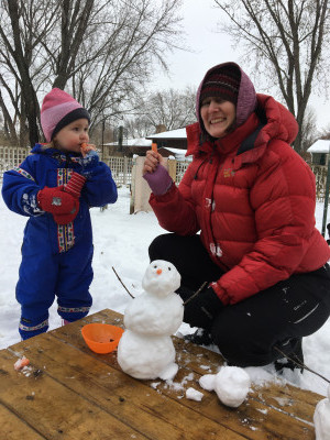 Playing in the snow (a must do in Minnesota) and eating a few carrots at the same time. Sorry Frosty!