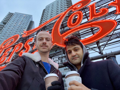 We love our local shops. Marc and Dev drinking coffee during a NYC walk, next to our new home in Queens.