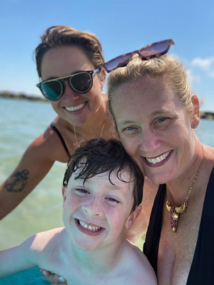 We love to travel and take 3-4 trips a year. This is us enjoying the waves in Nantucket. We had the best time playing in the waves